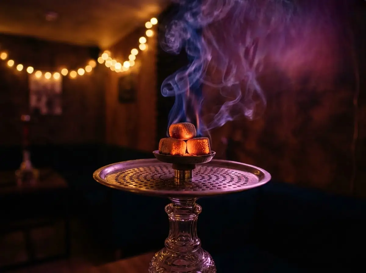 Close-up of a lit shisha pipe with glowing coals at Venue 5, the best shisha lounge in Ruislip